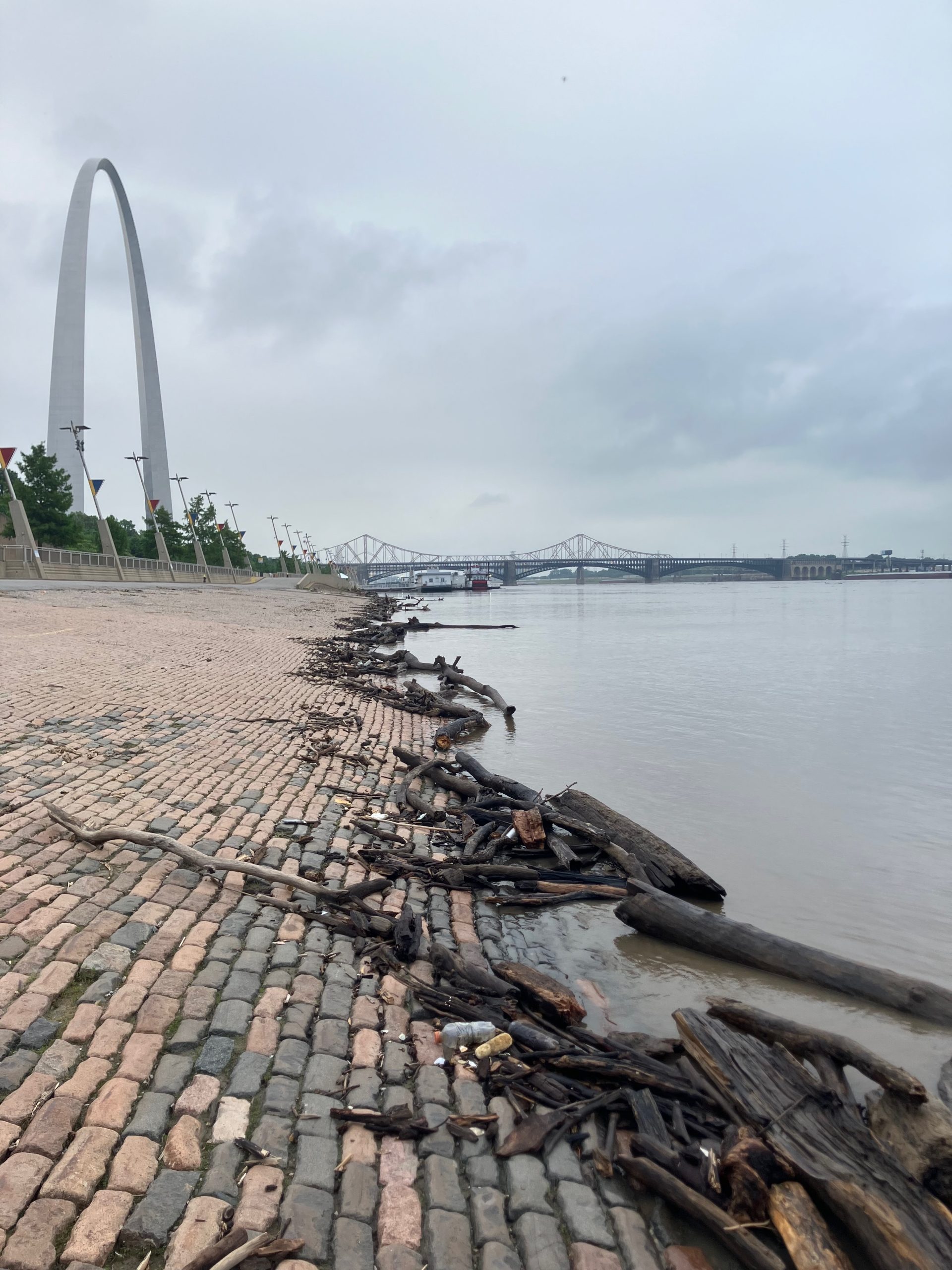 St. Louis's cobblestone riverfront, with the Arch and the Eads Bridge in the background.